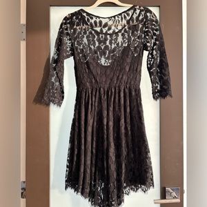 Ladies black lace dress with scalloped high /low hem